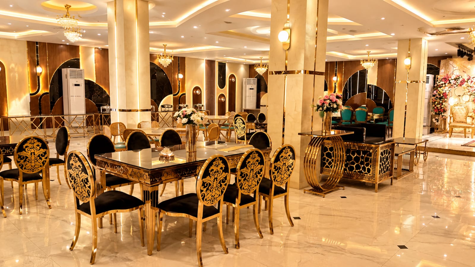 Inside Ovation Banquet with gold and black dining tables