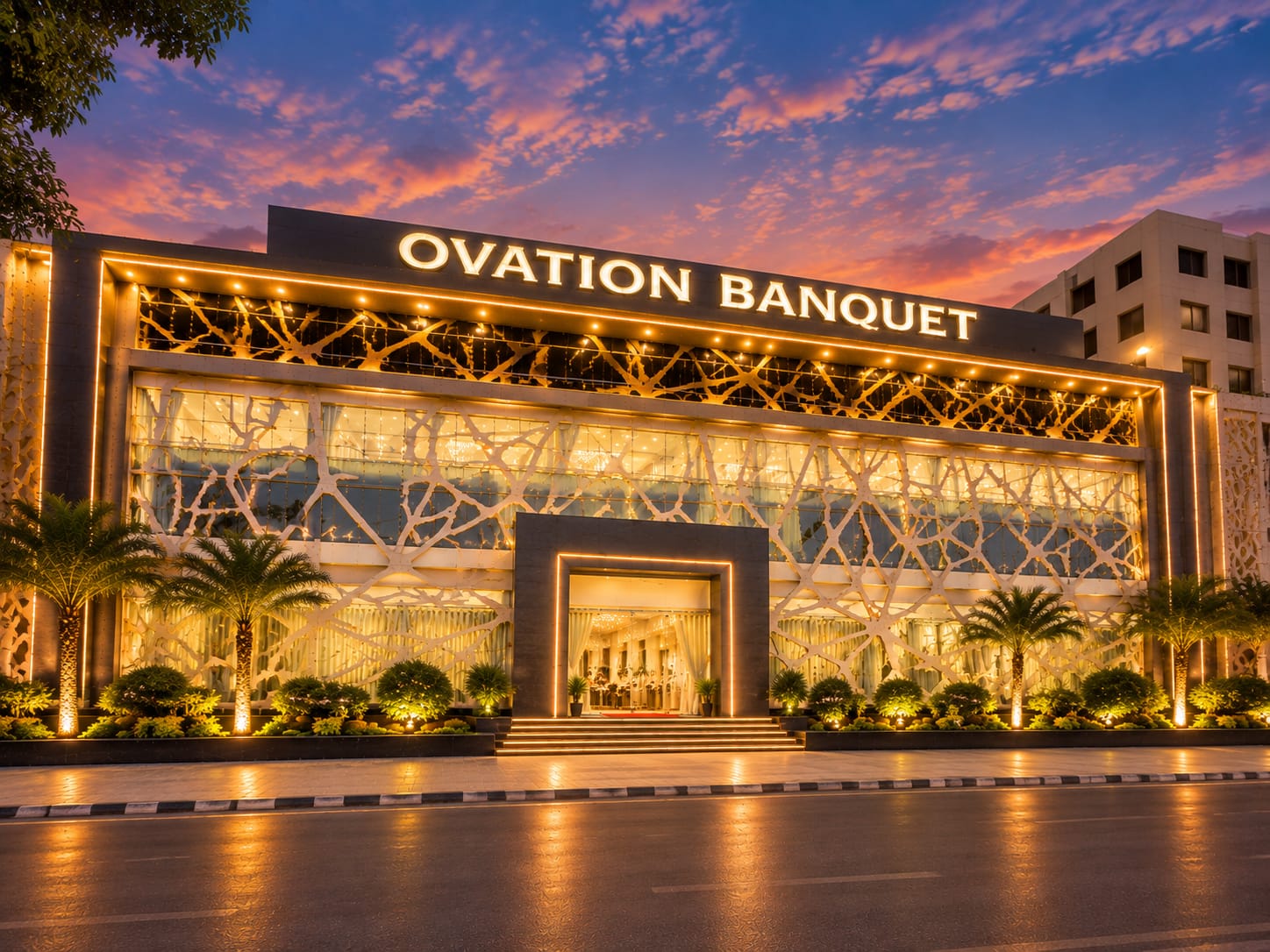 Ovation Banquet building lit up at sunset